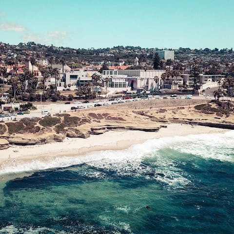 Walk over to the shoreline of La Jolla Beach in just two minutes