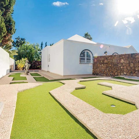Take to the mini golf course right in your backyard for afternoon fun