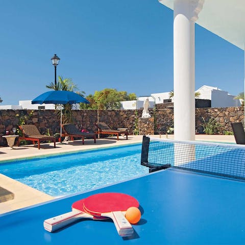 Play sets of table tennis whenever you're not in the cool waters of the private pool