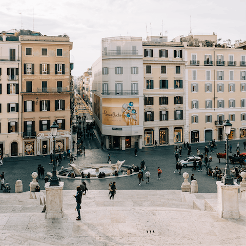 Take a seventeen-minute walk to the Piazza di Spagna and descend the Spanish Steps