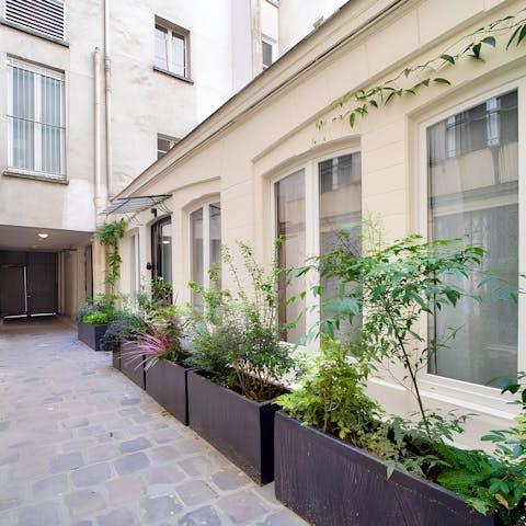 Step out onto the quiet courtyard and sip your morning coffee