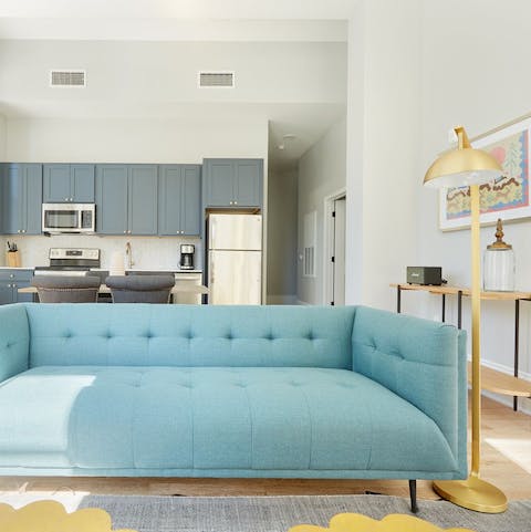 Lounge on the powder blue sofa with your favourite cocktail in hand