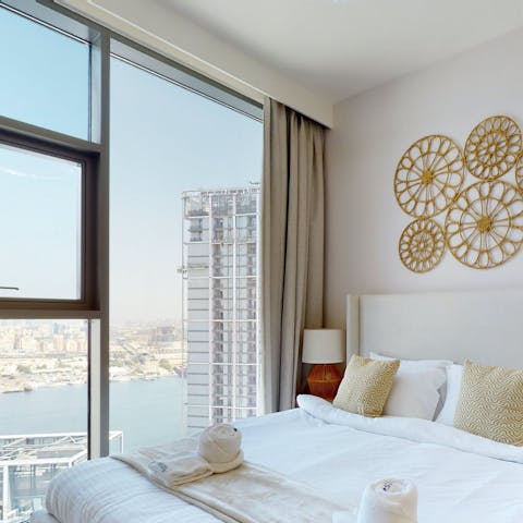 Wake up to views of Dubai Creek from the chic bedrooms