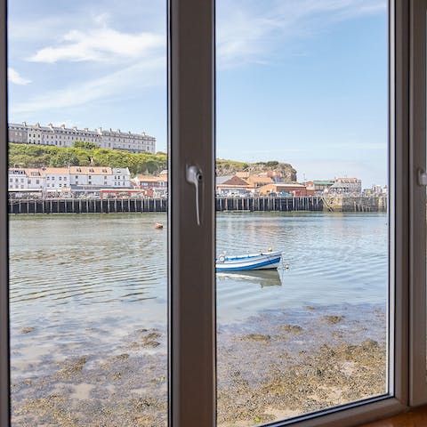 Gaze out of the window at the picturesque views of Whitby harbour