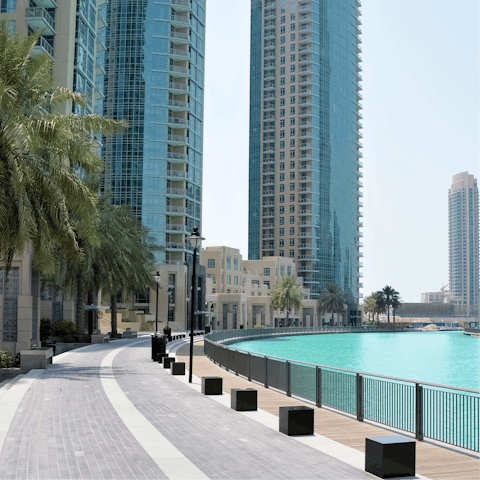 Take an atmospheric stroll along the promenade towards the vibrant marina