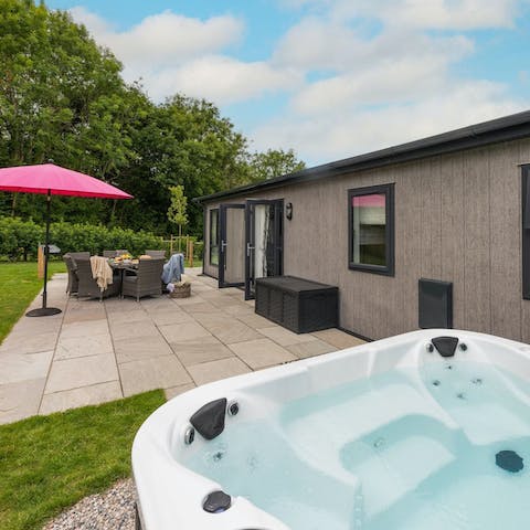 Enjoy a long soak in the private hot tub after a day of adventure
