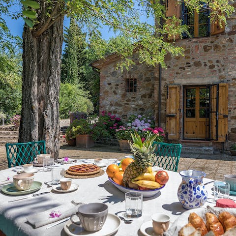 Dine on Tuscan delicacies at the outdoor dining table