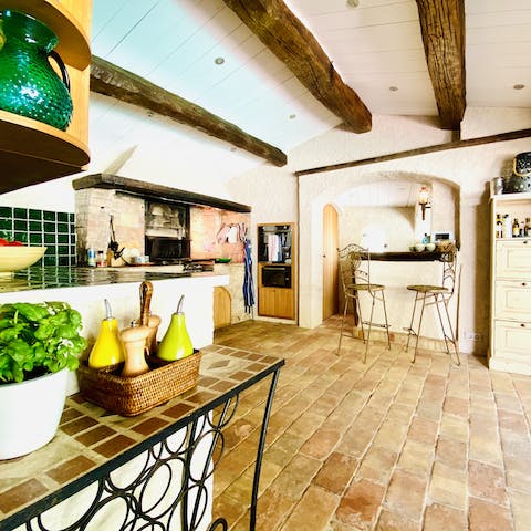 Make use of the summer kitchen with its wood-burning oven and grill