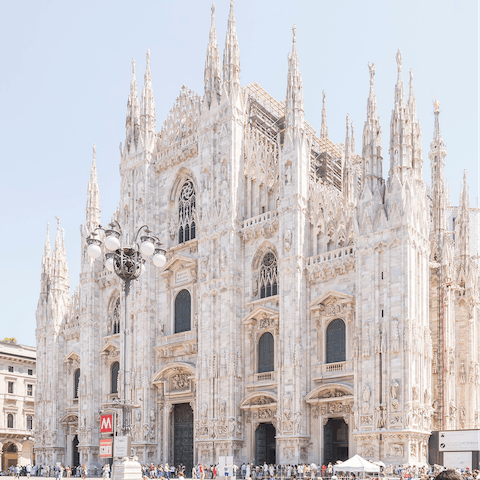 Admire the gorgeous Duomo di Milano, just a fourteen-minute walk away