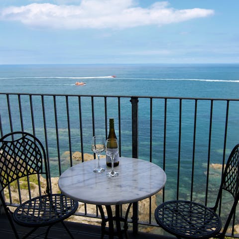 Sip wine on the outdoor terrace with uninterrupted sea views