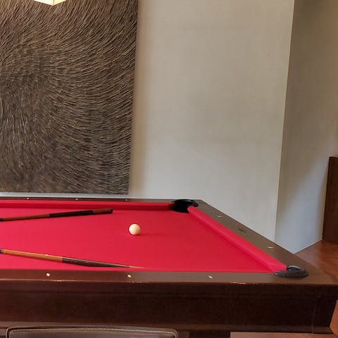 Play a game of pool in the games room