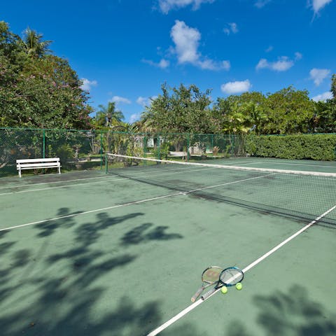 Play doubles on the private tennis court