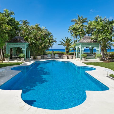 Swim laps in the huge, Roman-style pool