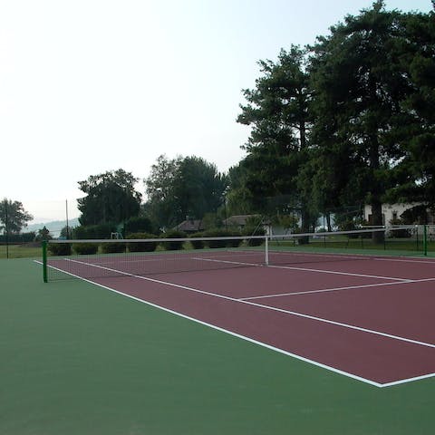 Enjoy a game of tennis with loved ones on the on-site court