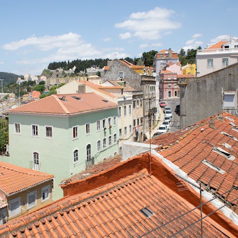 Gaze out to views of Lisbon's red rooftops from your first-floor duplex
