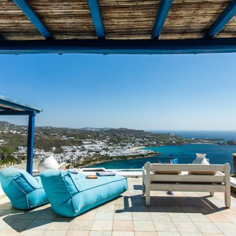 Grab a book a get comfy on the terrace as the sea stretches out before you