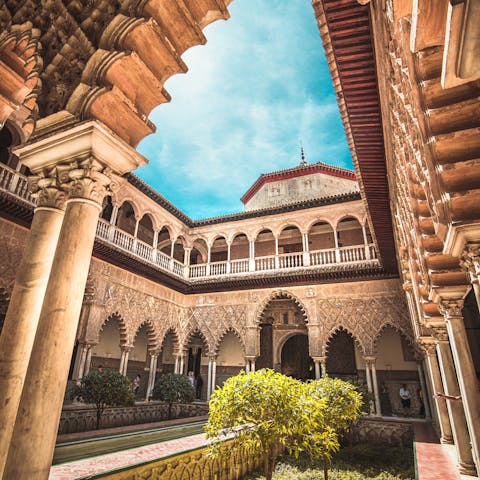 Admire the Real Alcázar de Sevilla, 800 metres away