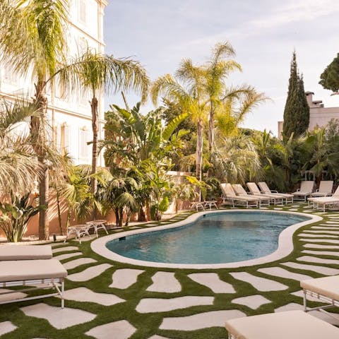 While away sunny afternoons by the shared swimming pool