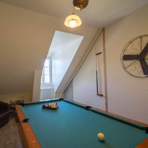 Challenge fellow guests to a pool match on the games room's table