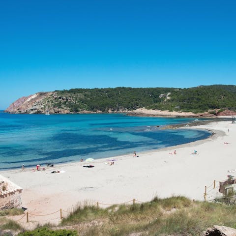 Explore Cala Morell, starting with the beach, only minutes away