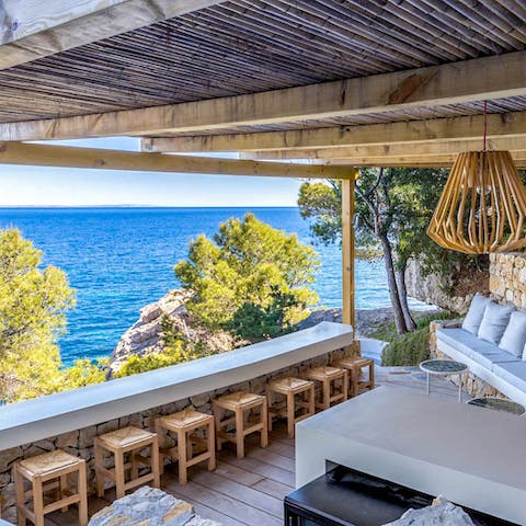 Get the proper Ibiza experience in the private bar over the water