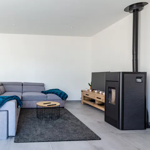 Cosy up by the contemporary pellet stove for a movie night in