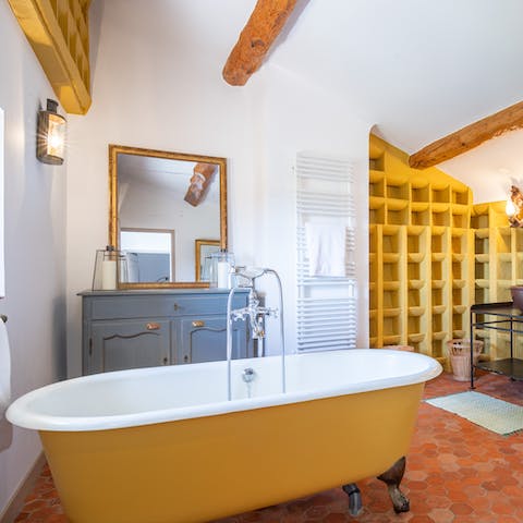 Treat yourself to a long soak in cast iron bathtub in the transformed pigeon house