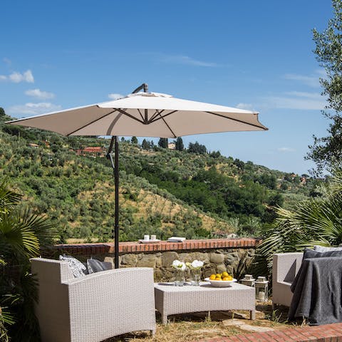 Sip a sundowner overlooking the Tuscan countryside