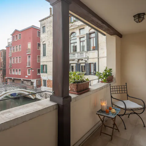 Slip from your bedroom and onto this private balcony overlooking the canal