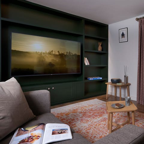 Watch a movie in the cosy lounge at the end of a day hiking