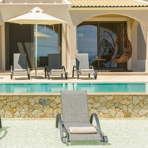Sunbathe on the loungers in the shallow pool after enjoying a dip