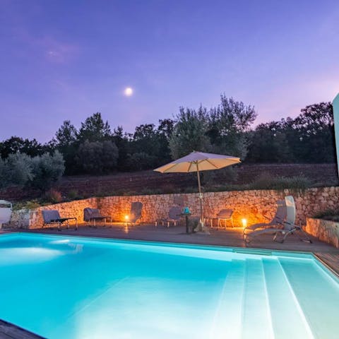 Take an evening dip in the shimmering swimming pool 