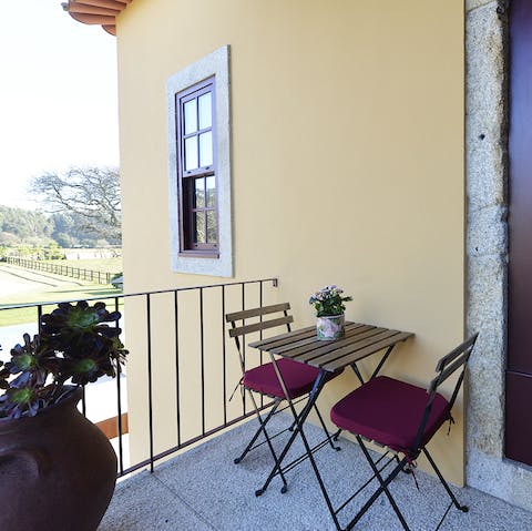 Savour a morning cup of coffee on this lovely balcony