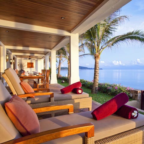 Admire the ocean views from a comfy sun lounger