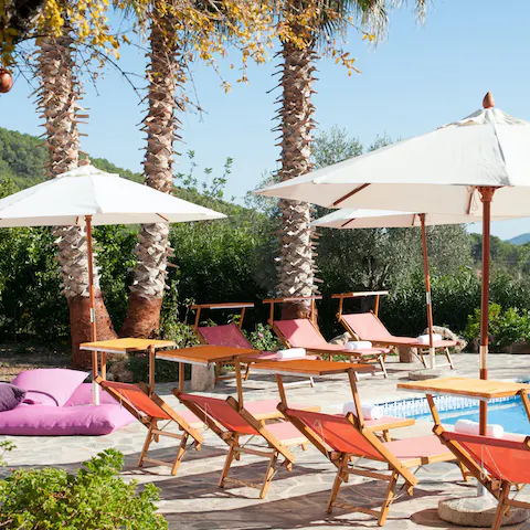 Doze off in the endless Ibizan sunshine on the poolside lounge chairs