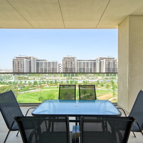 Enjoy some fine cuisine out on the balcony overlooking Dubai Hills Park