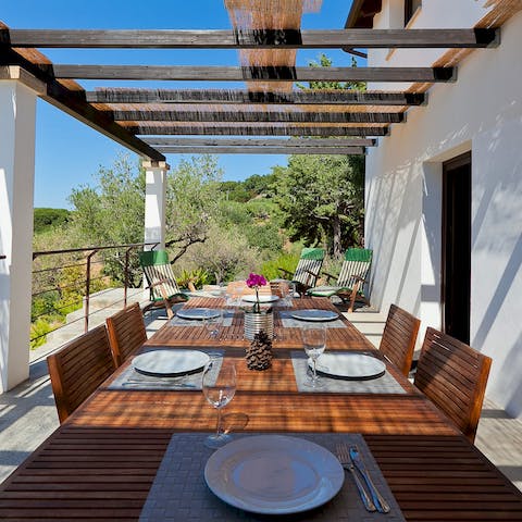 Sit down to lunch on the terrace overlooking the pool