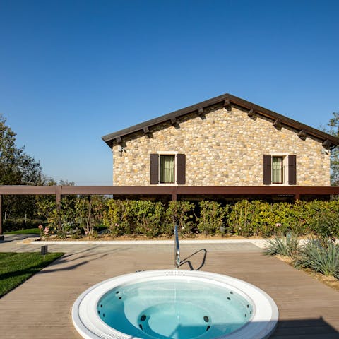 Sink into the hot tub at the golden hour