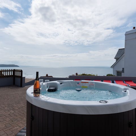 Enjoy a glass of fizz in the hot tub as the day draws to a close