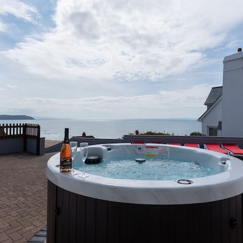 Enjoy a glass of fizz in the hot tub as the day draws to a close