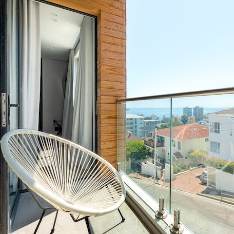 Admire ocean views from your private glass fronted balcony