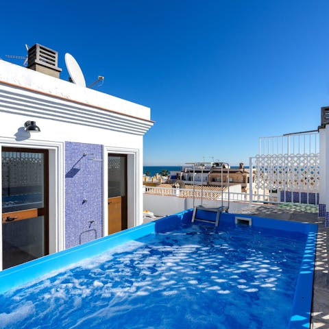 Spend time relaxing in your private rooftop jacuzzi