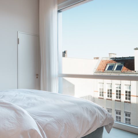 Wake up to views of the city's charming architecture through the floor-to-ceiling windows
