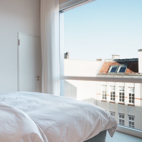 Wake up to views of the city's charming architecture through the floor-to-ceiling windows