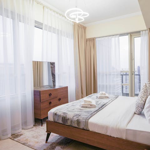 Enjoy panoramic city views from the main bedroom and let the natural light flood in during the day