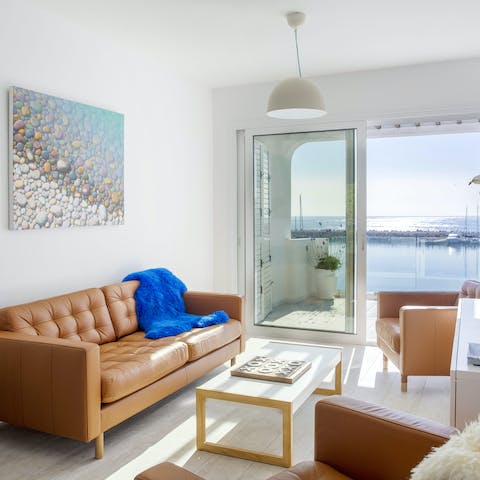 Grab a book and stretch out on the sofa, with a full view of the marina