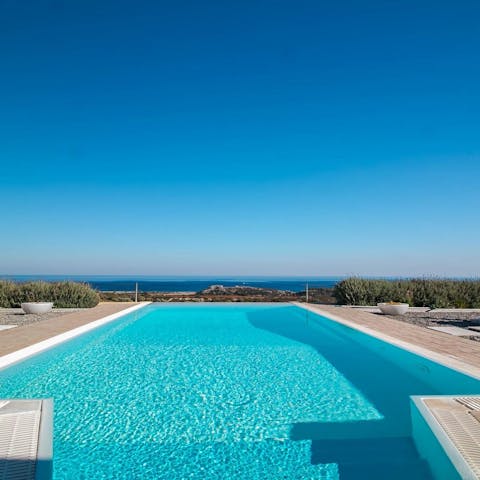 Swim in the infinity-edge pool overlooking the sea