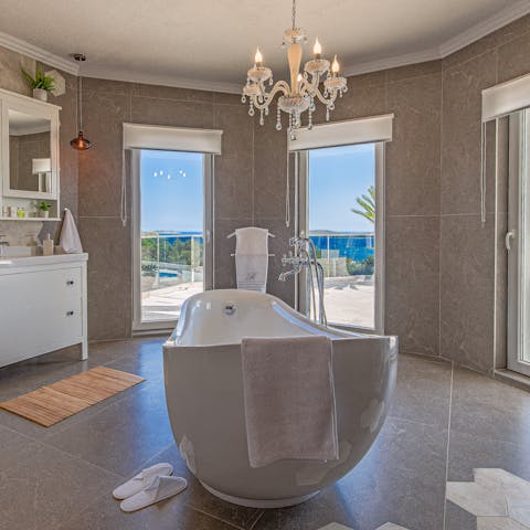 Enjoy an indulgent soak in the bathtub with a view