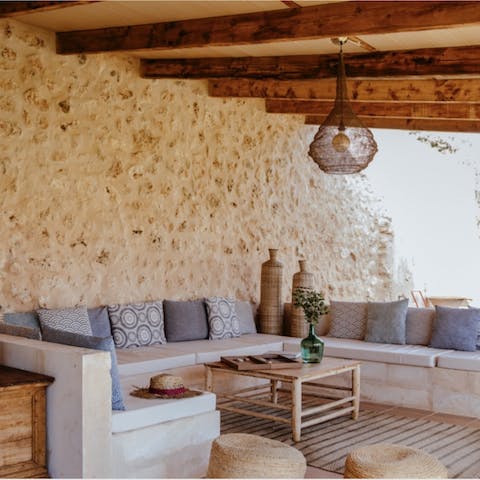 Lounge the day away on Moroccan-style sofas in the shade