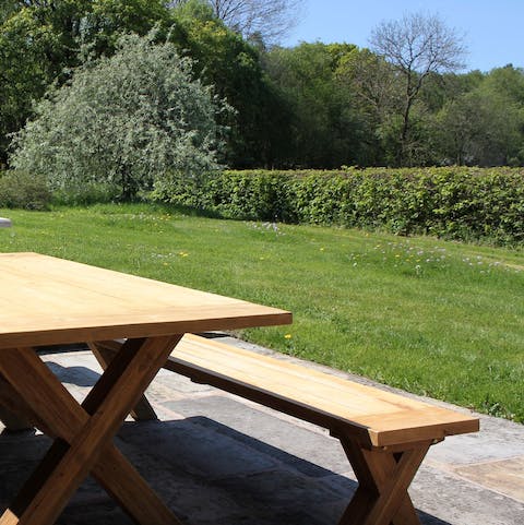 Dine alfresco at the picnic table on on sunny days